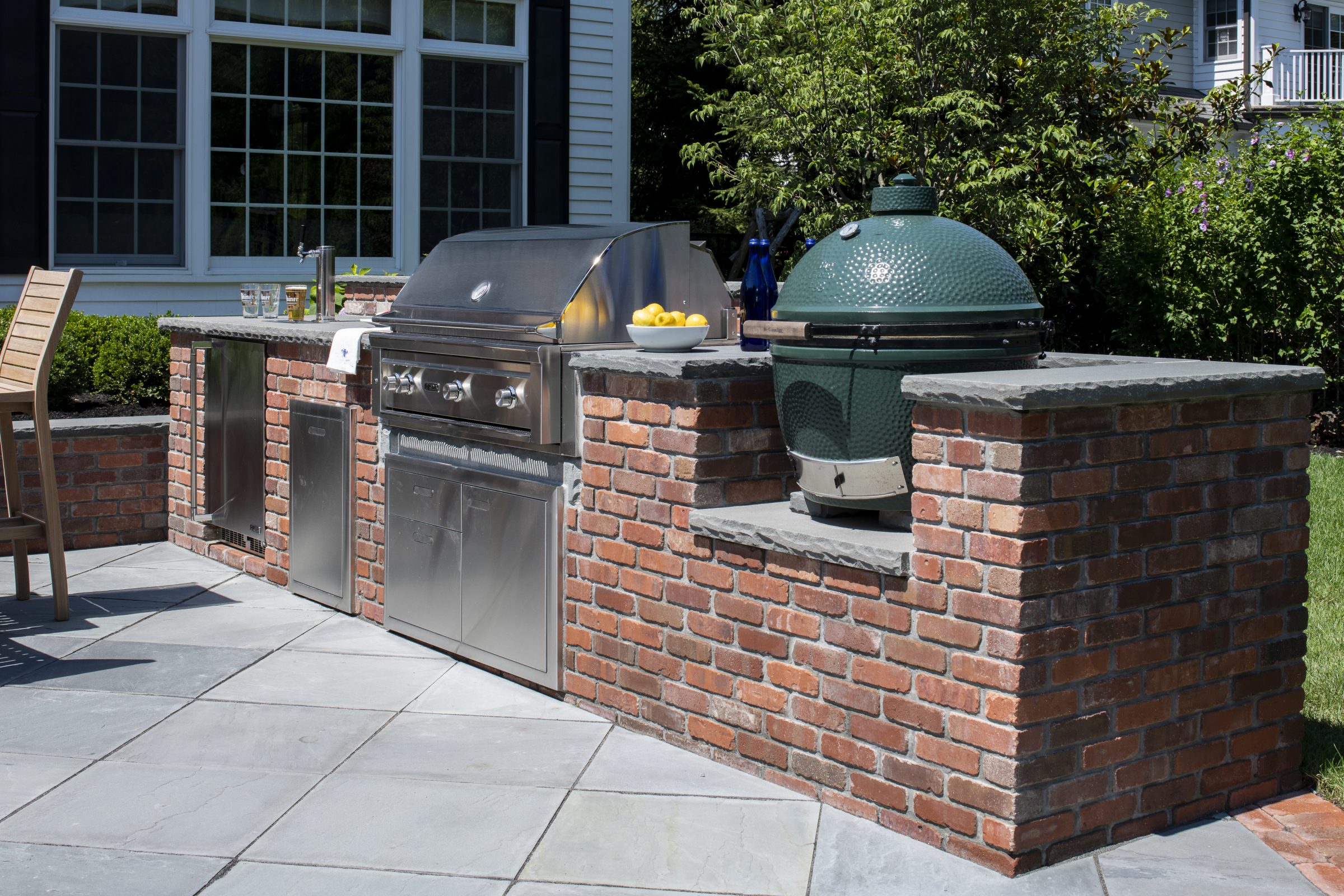 Outdoor kitchen with grill and smoker