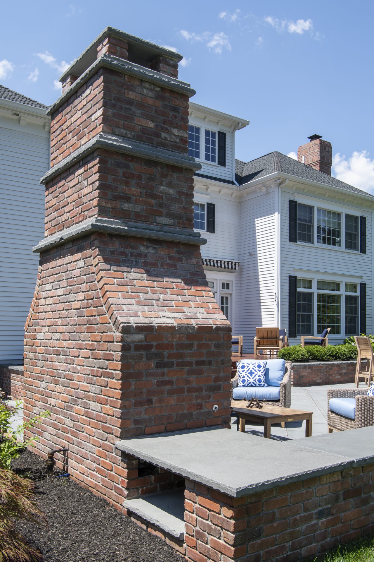 Brick outdoor fireplace with seating area
