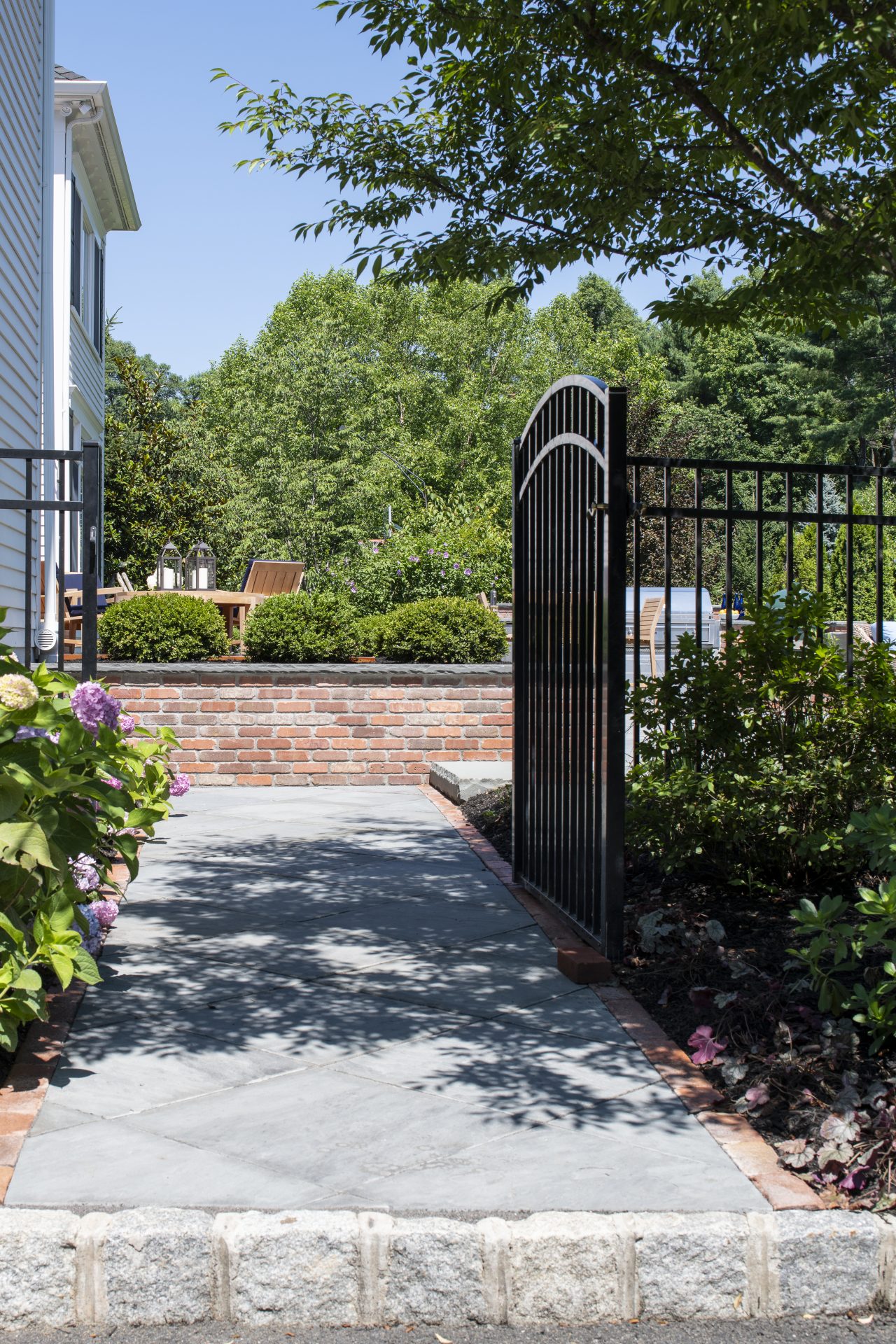 Garden path with wrought iron gate