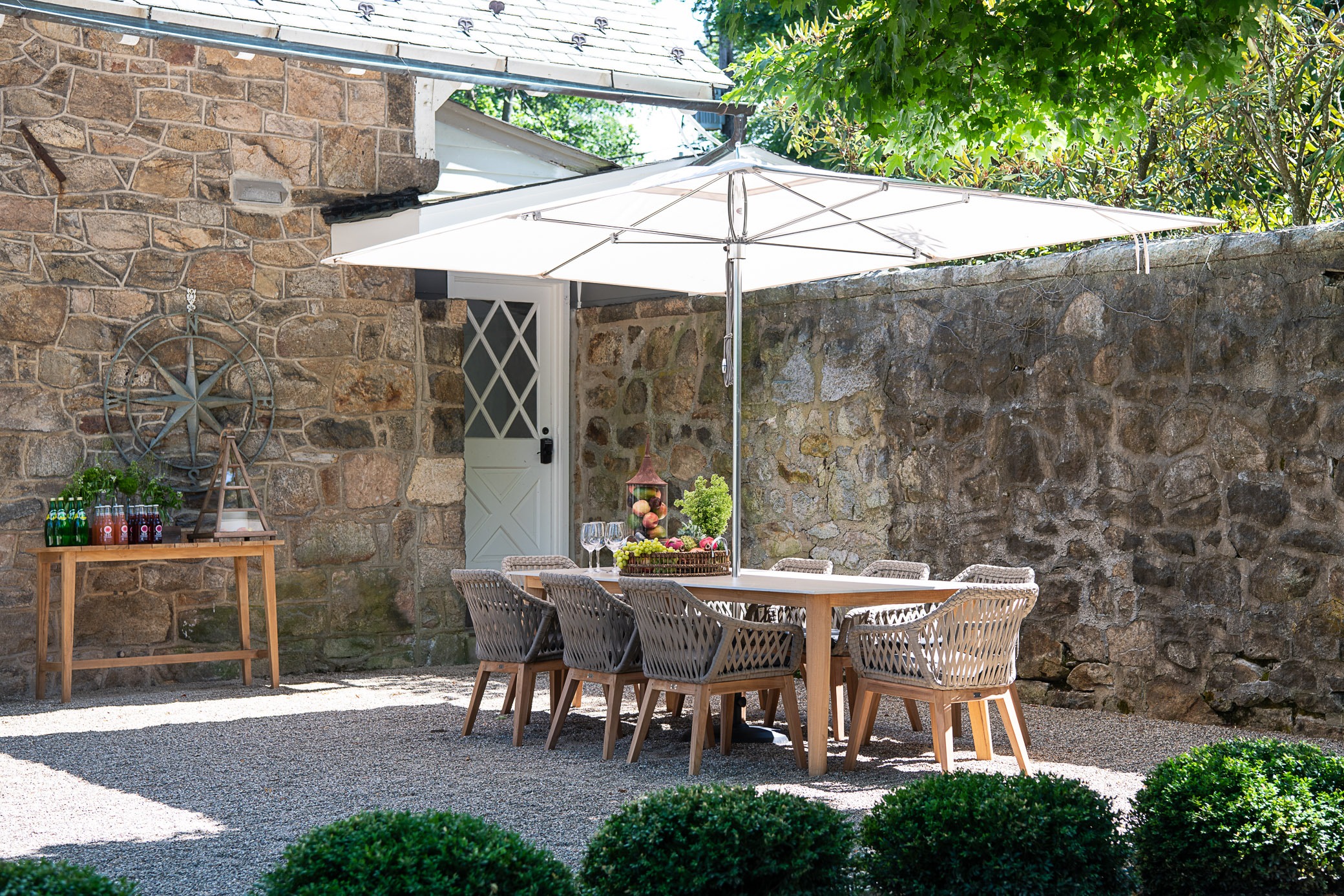 Outdoor dining area with stone wall
