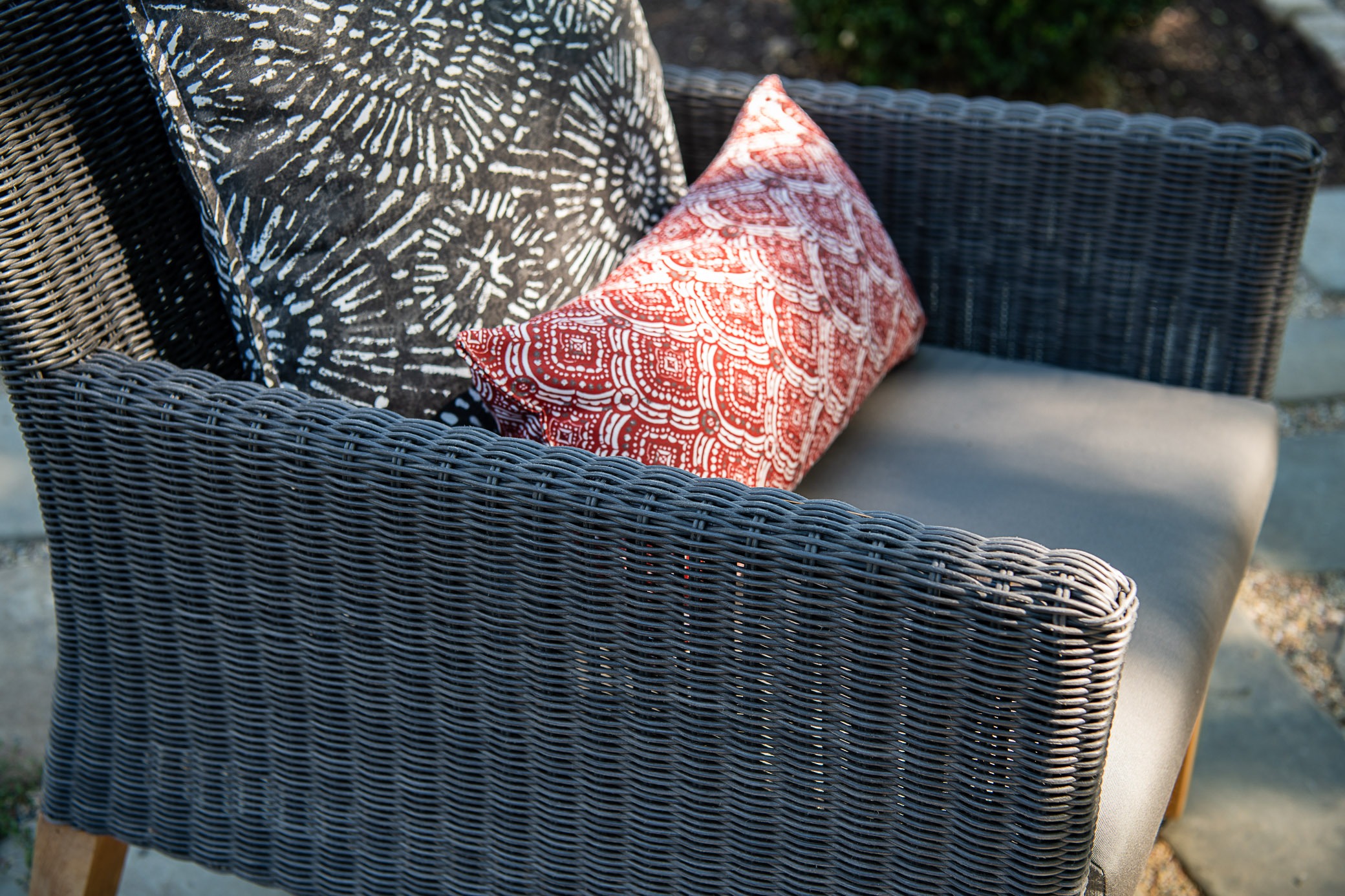 Wicker chair with decorative pillows