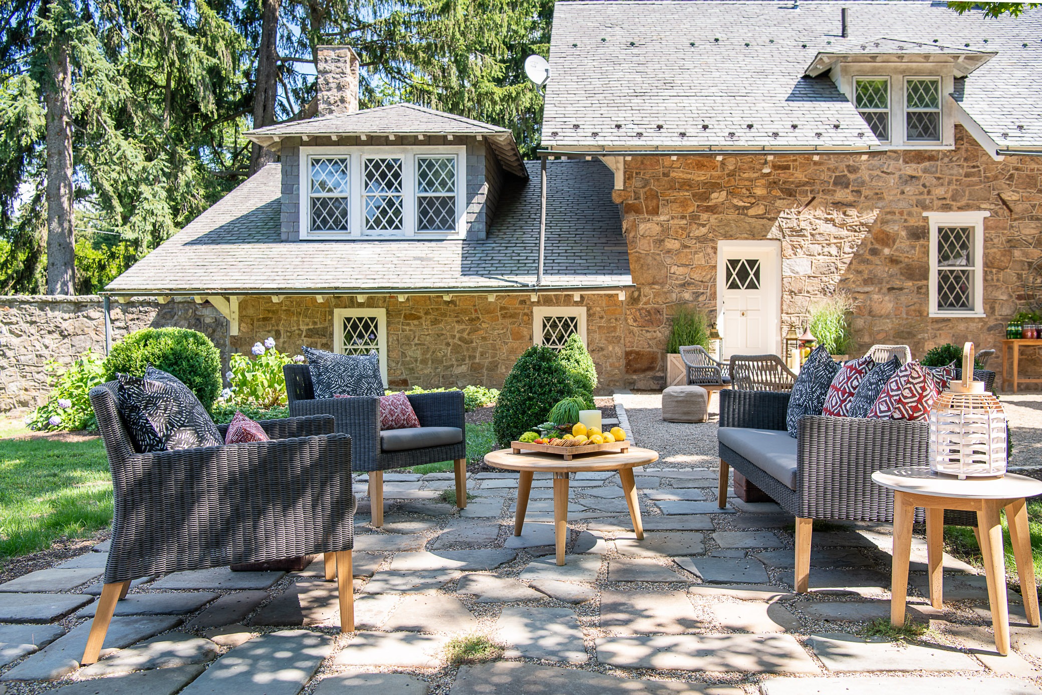 Cozy outdoor patio with wicker furniture.