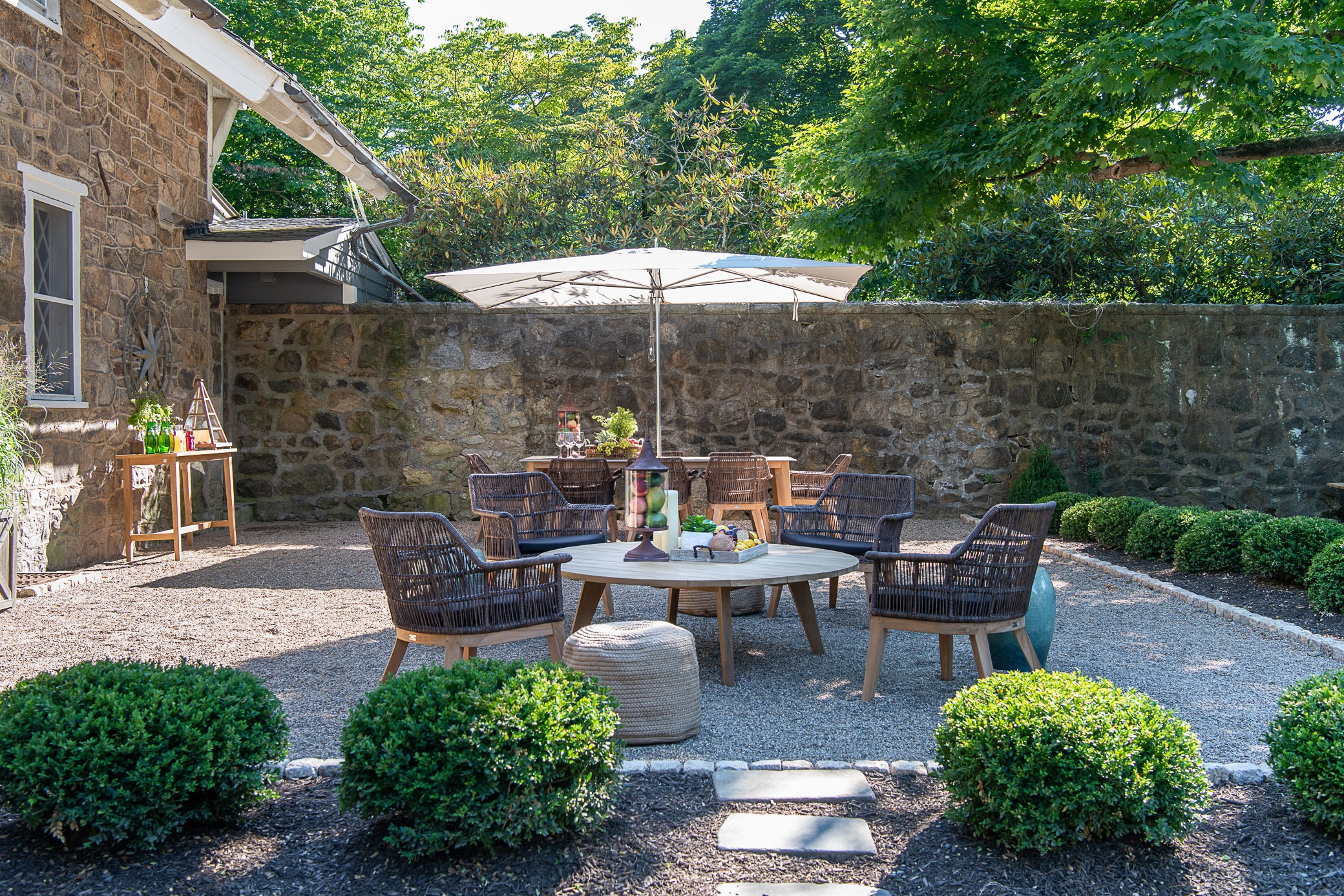 Outdoor patio with wicker furniture and umbrella