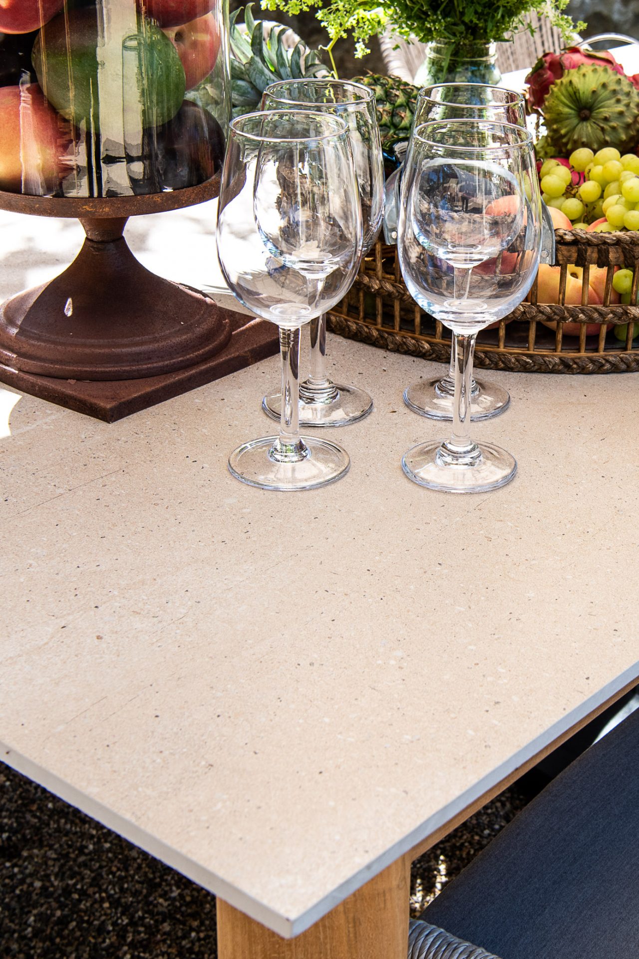 Table set with fruit and wine glasses