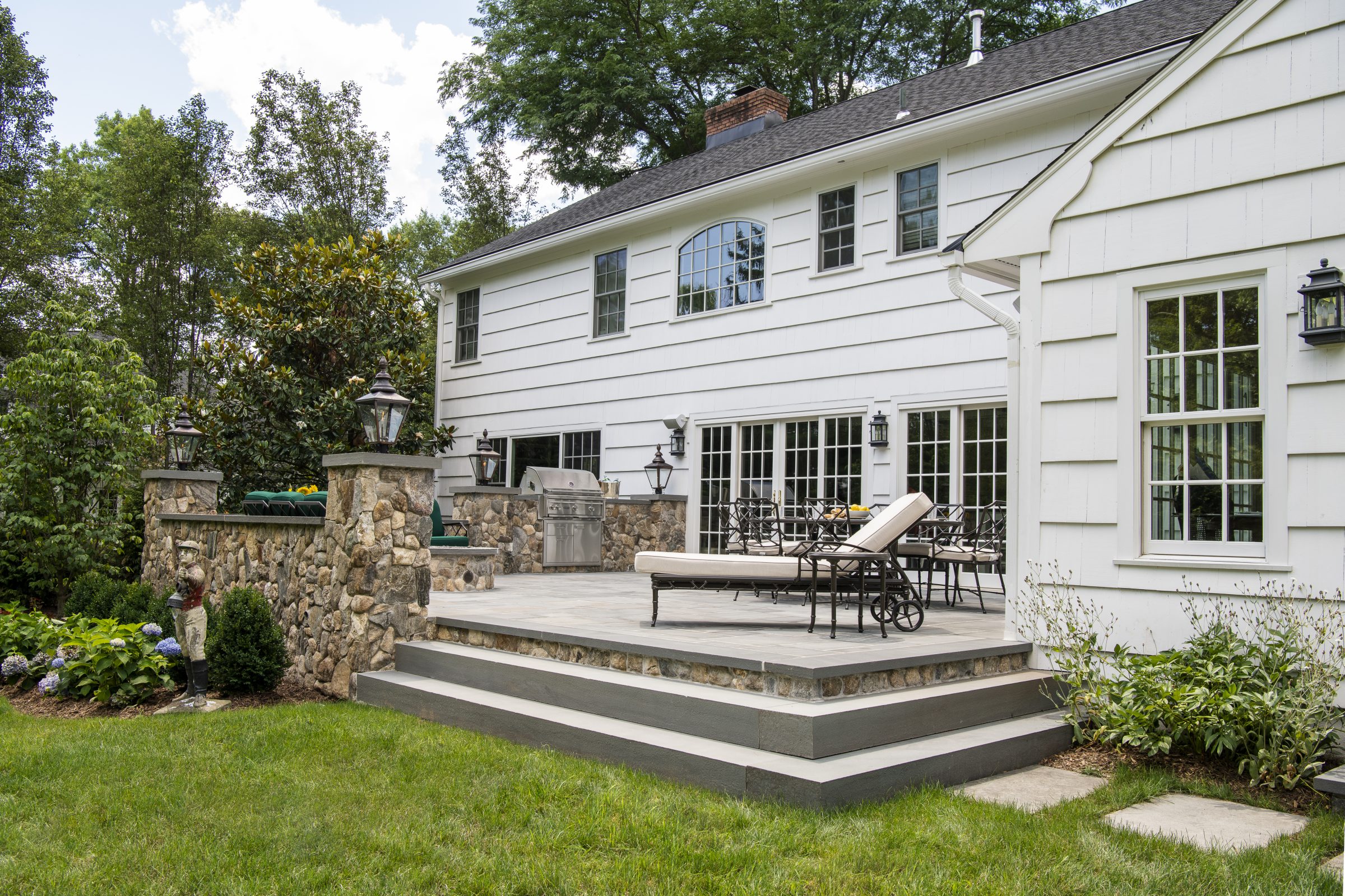 Elegant backyard patio with stone features