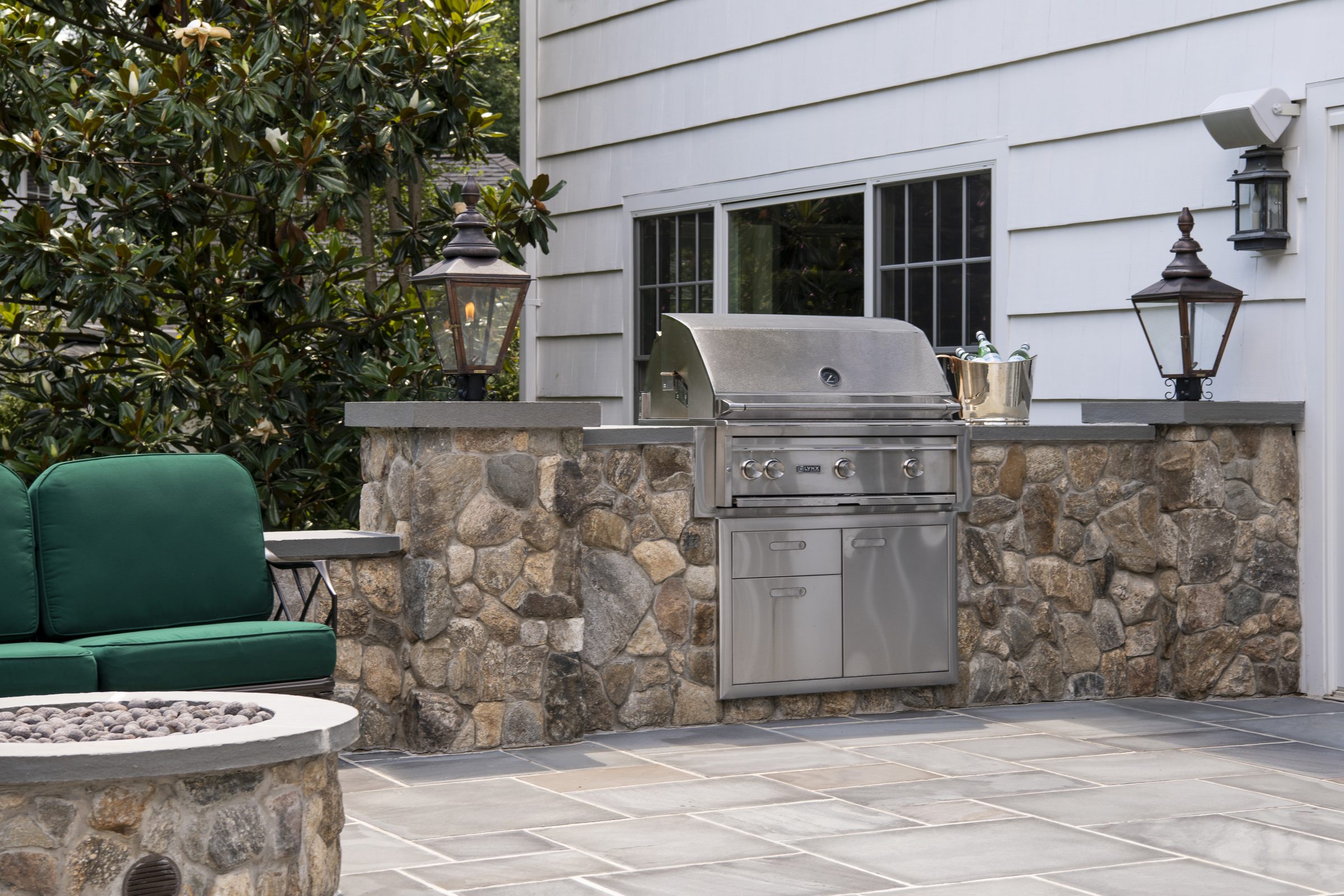 Outdoor stone patio with built-in grill