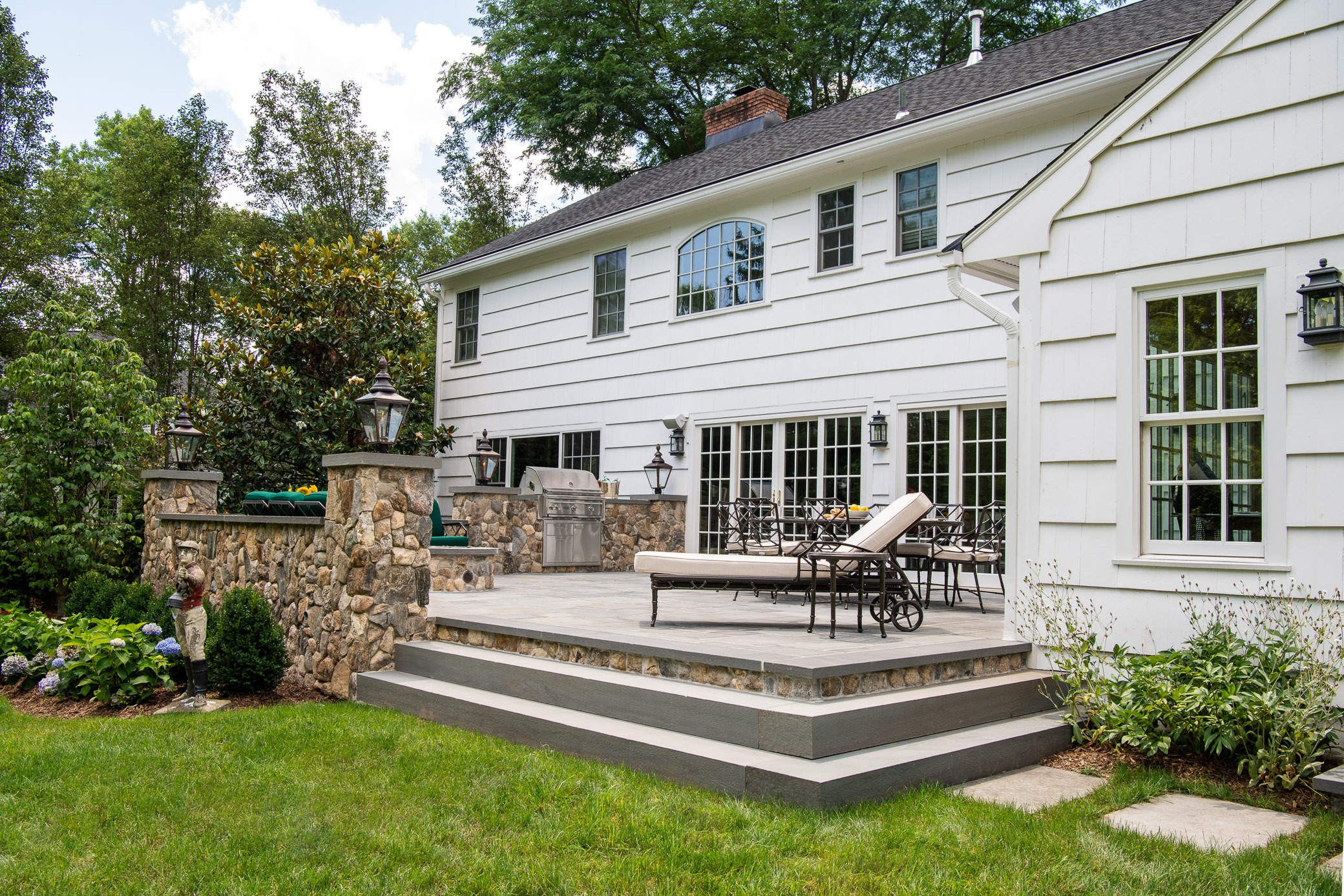 Elegant backyard patio with lounge chairs
