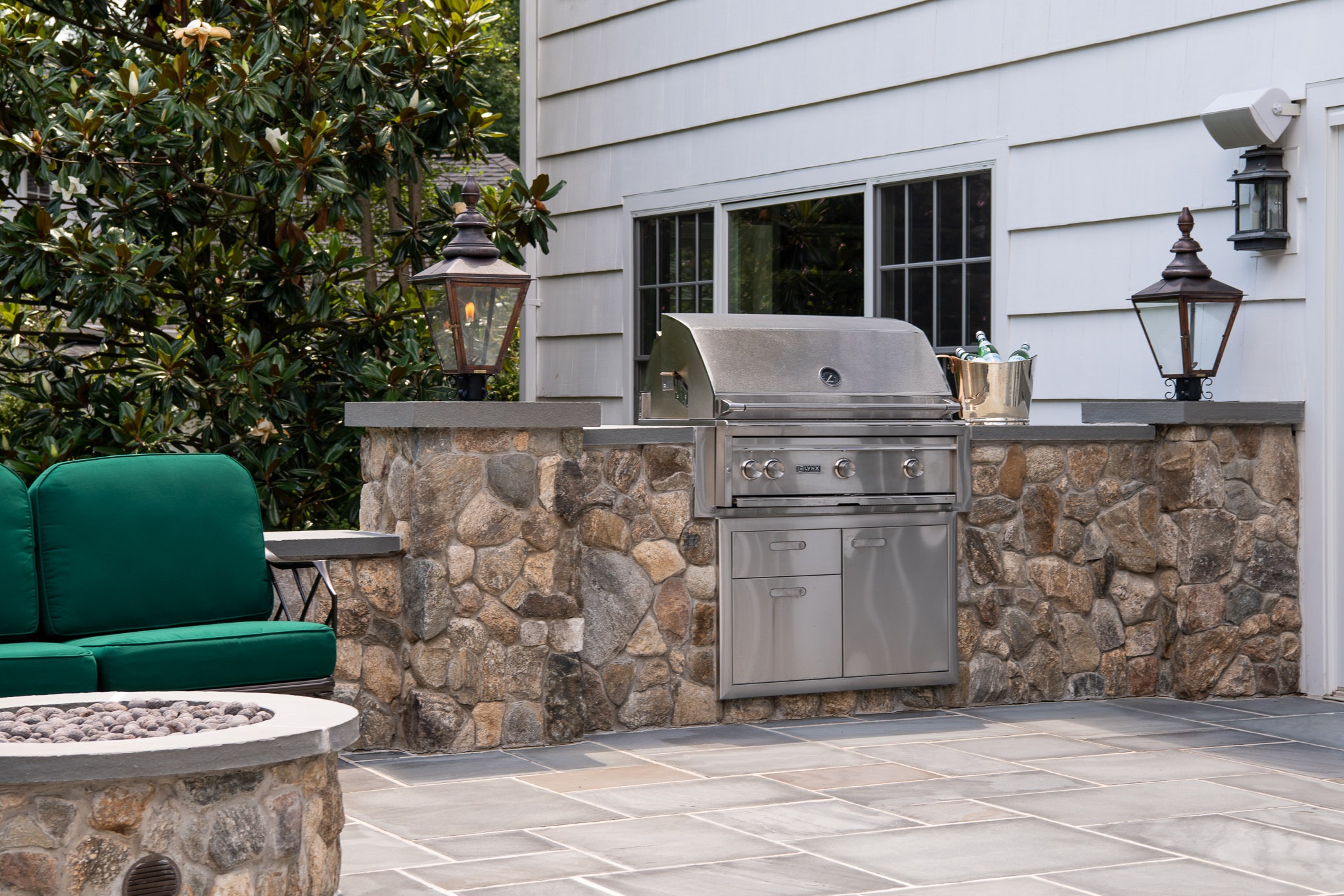 Outdoor kitchen with stone and grill