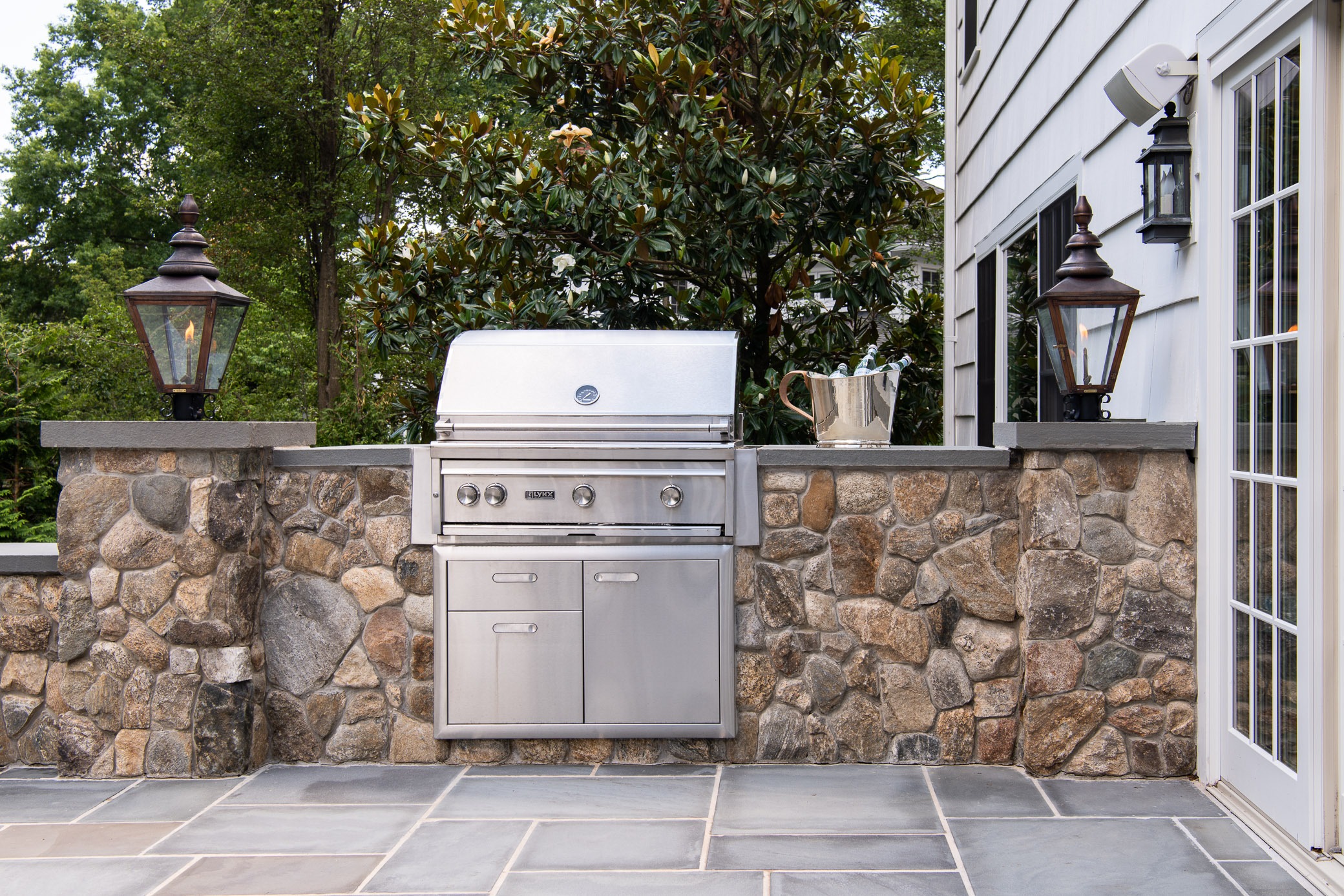 Outdoor stone kitchen with stainless grill