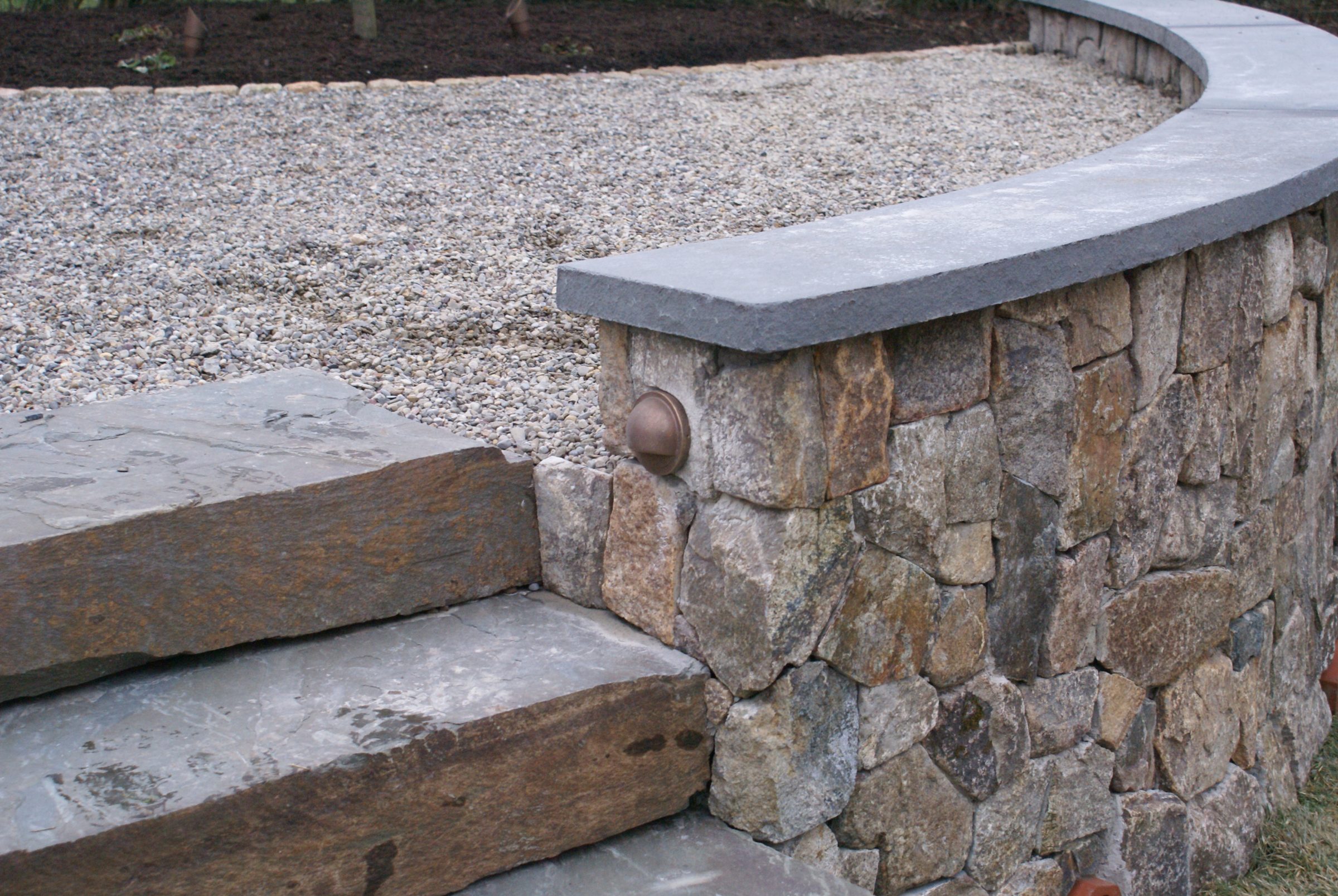 Stone steps with retaining wall light