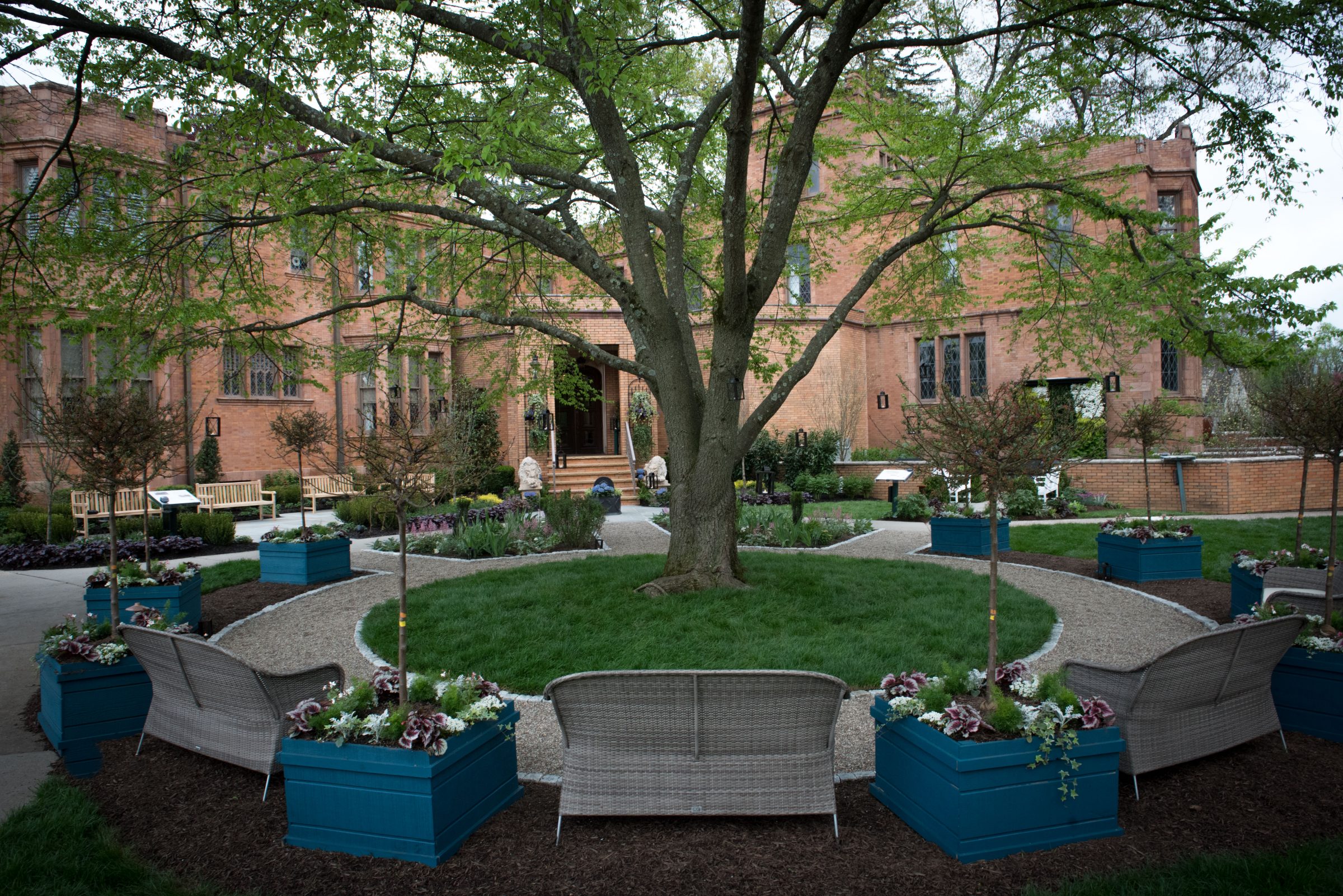 Garden courtyard with brick building backdrop