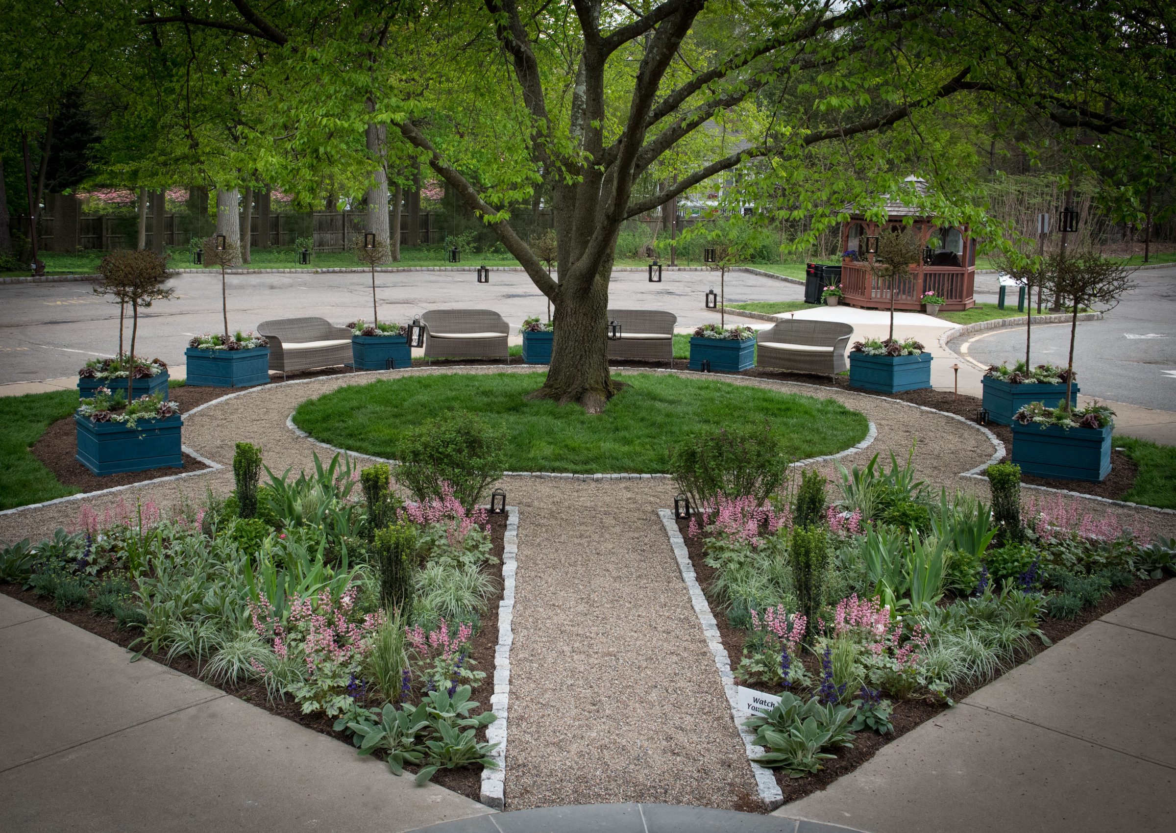 Well-manicured garden with seating area.