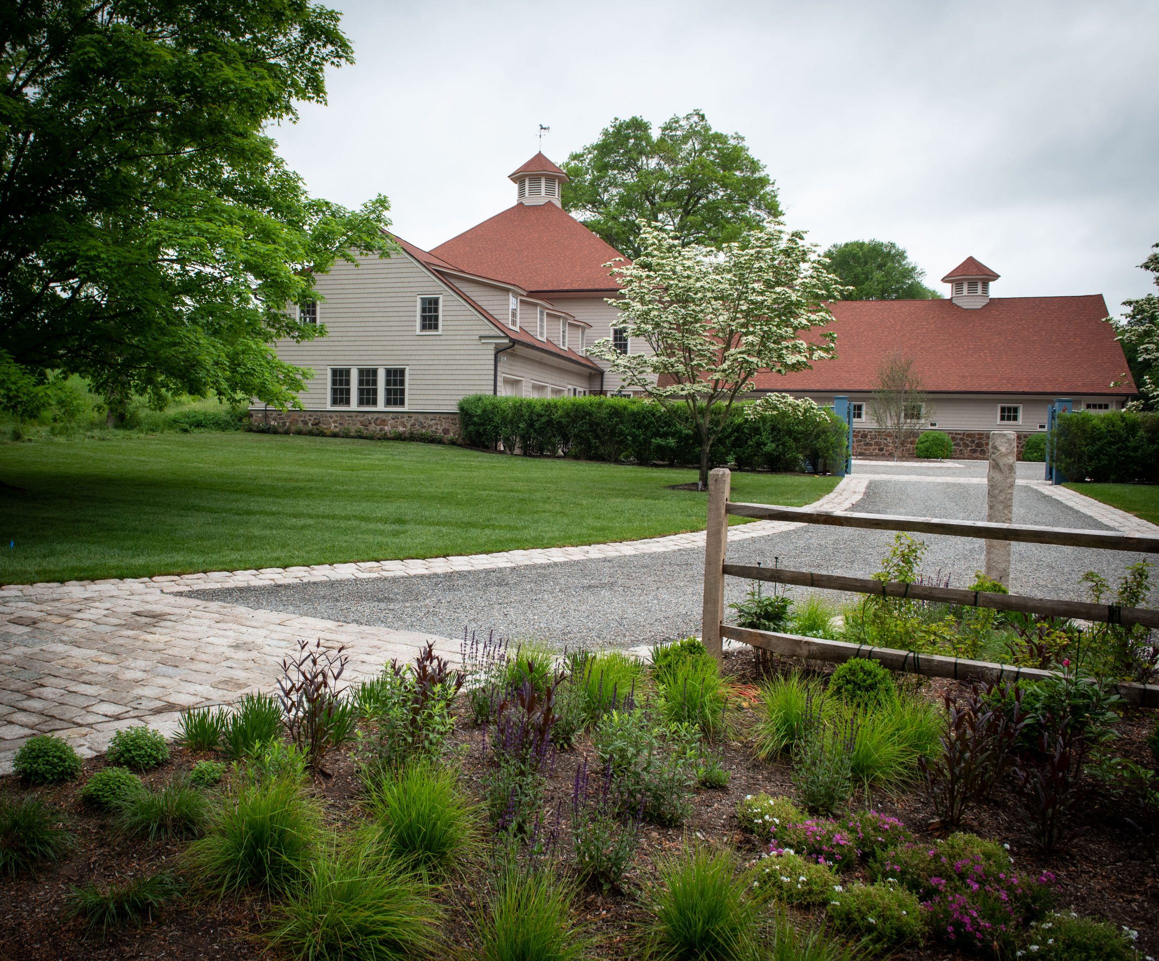 Quaint house with red roof and garden