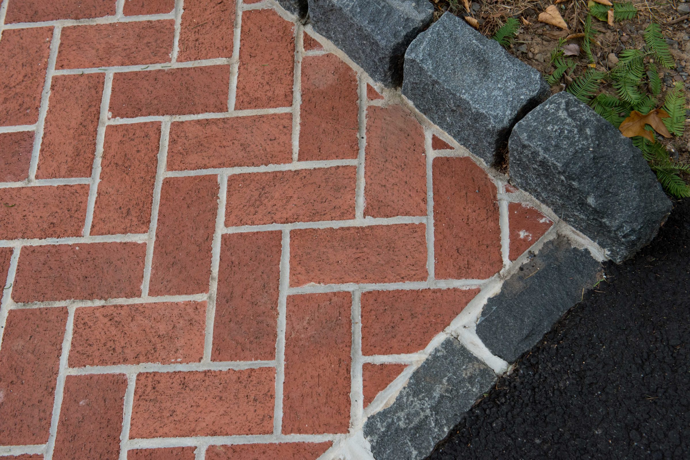 Brick herringbone pattern with stone border