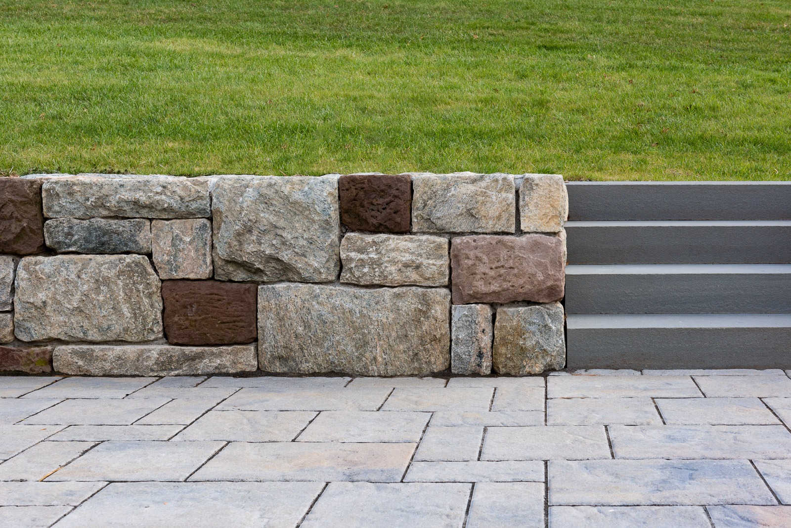 Stone wall with grass and steps