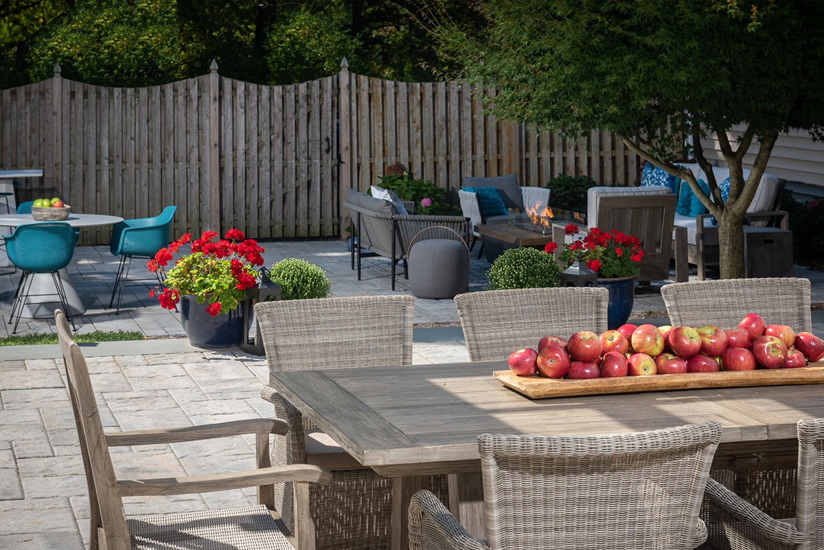 Outdoor patio with furniture and apples.