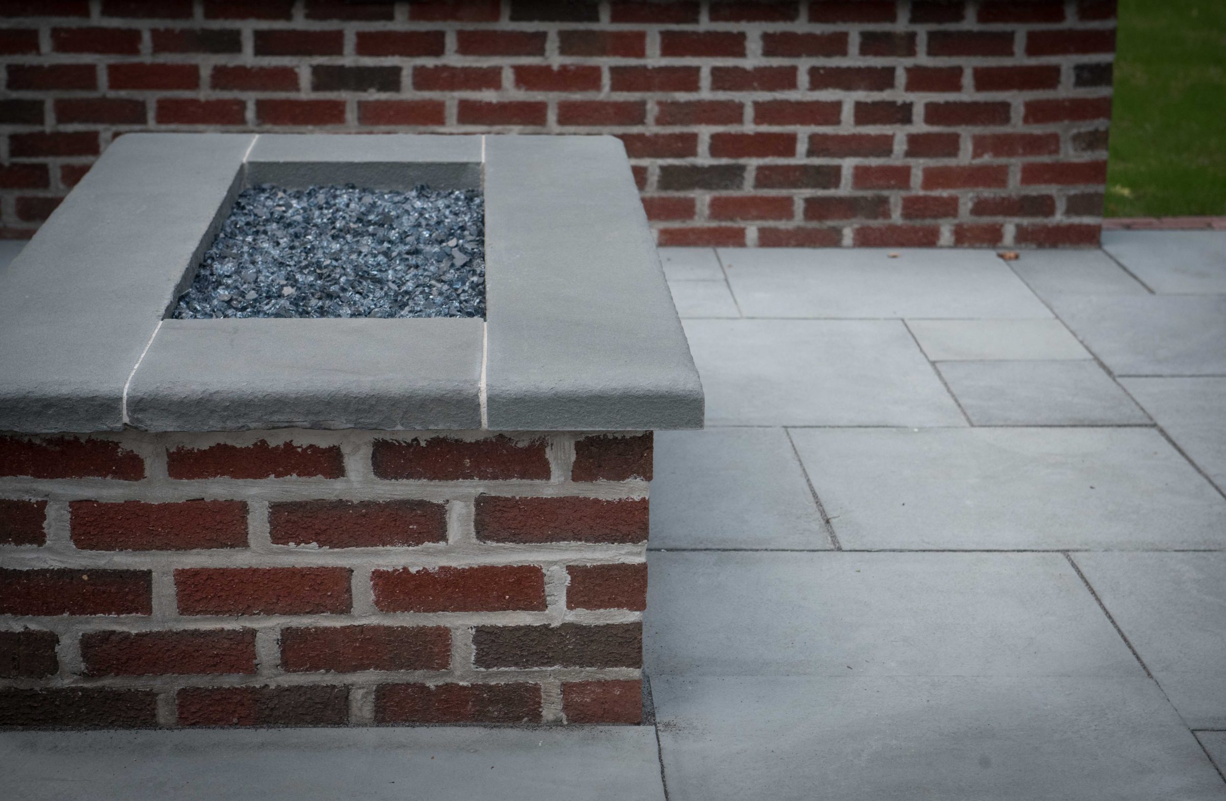 Brick and stone fire pit on patio