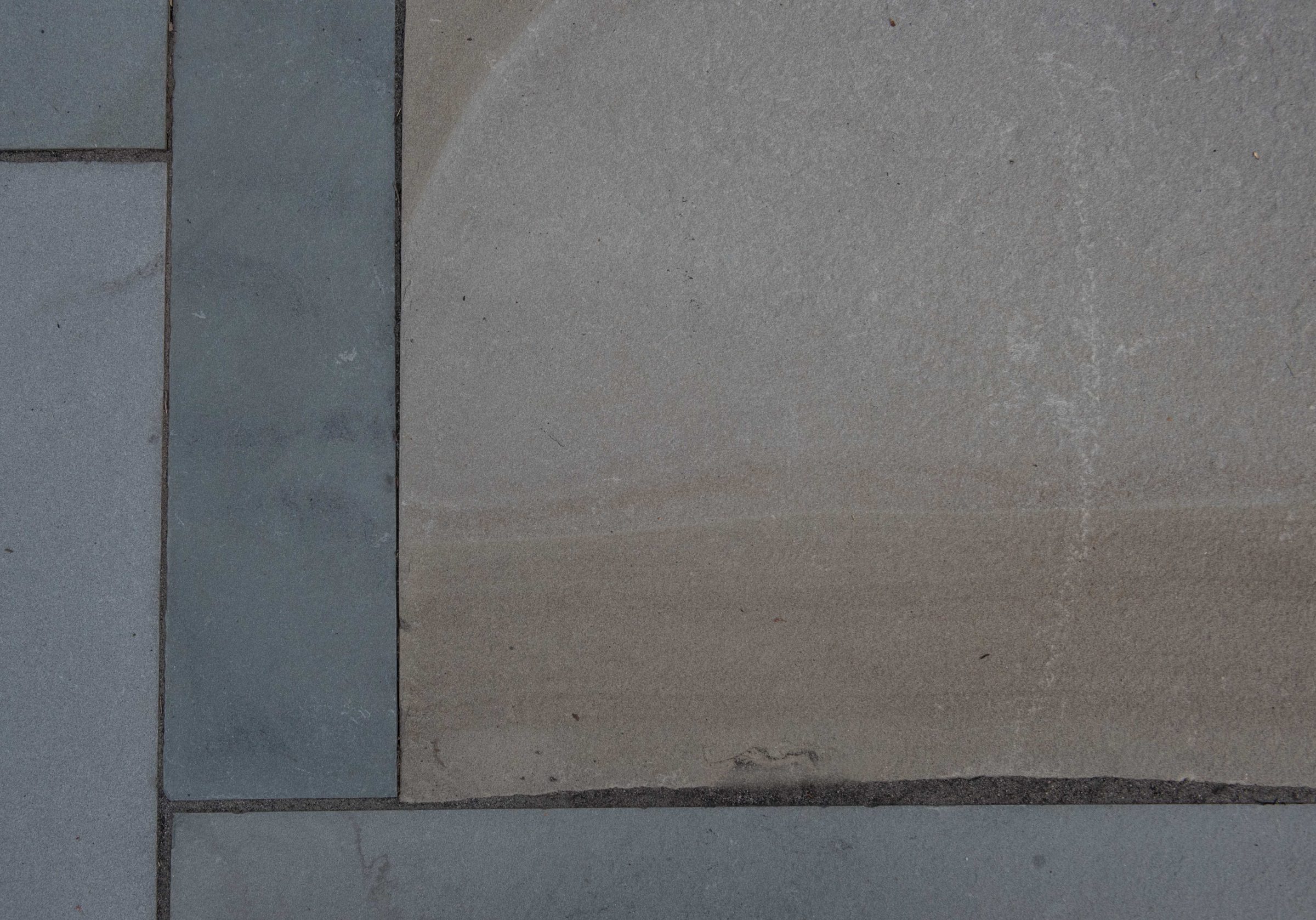 Close-up of textured stone tiles.