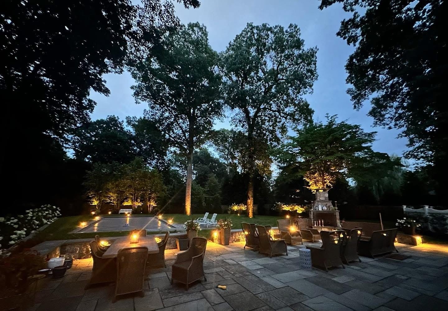 Outdoor patio with seating and evening lights