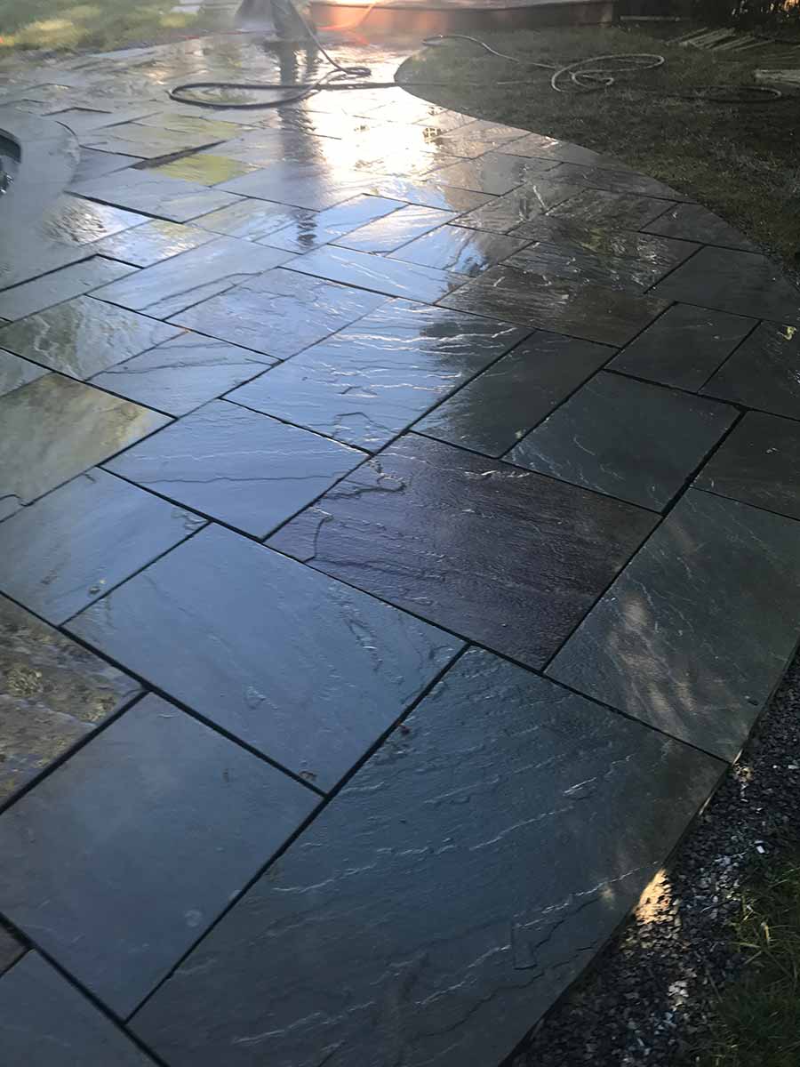 Wet slate tiles on a curved patio