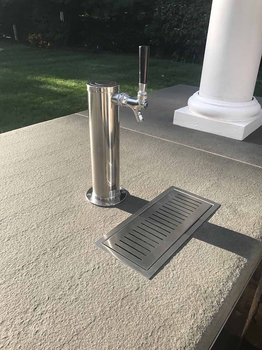 Outdoor beer tap on concrete countertop