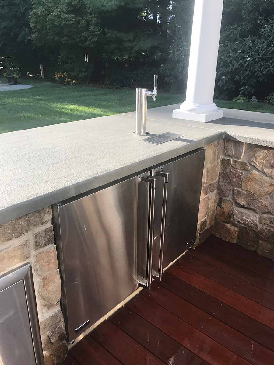 Outdoor kitchen with stone and stainless steel