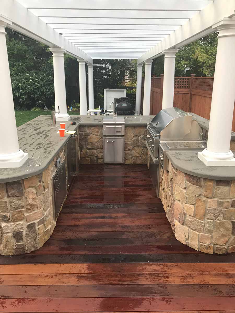 Outdoor kitchen with pergola and grill