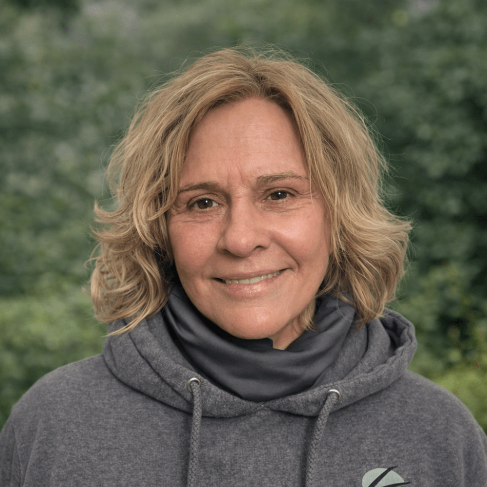 Smiling woman outdoors in hoodie
