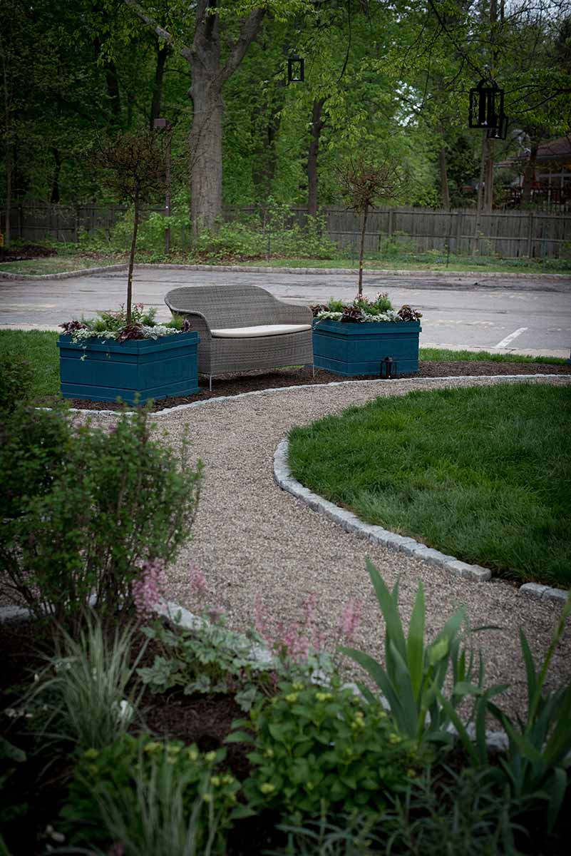 Garden path with bench and planters