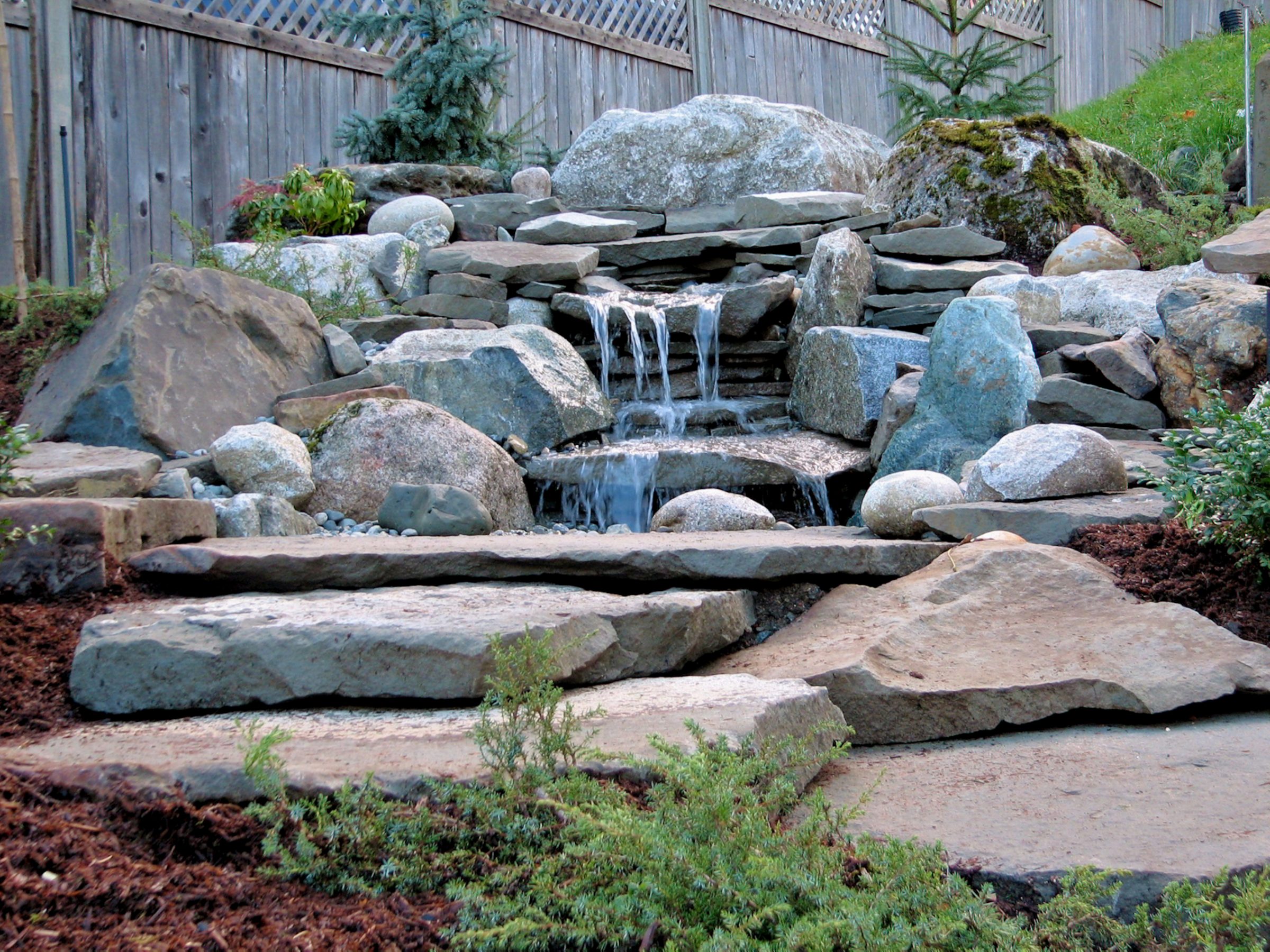 Rock waterfall in a landscaped garden
