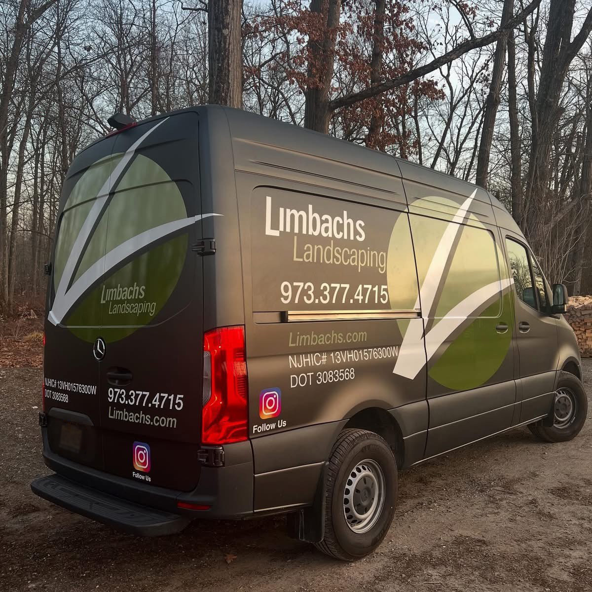 Limbachs Landscaping branded van parked in wooded area
